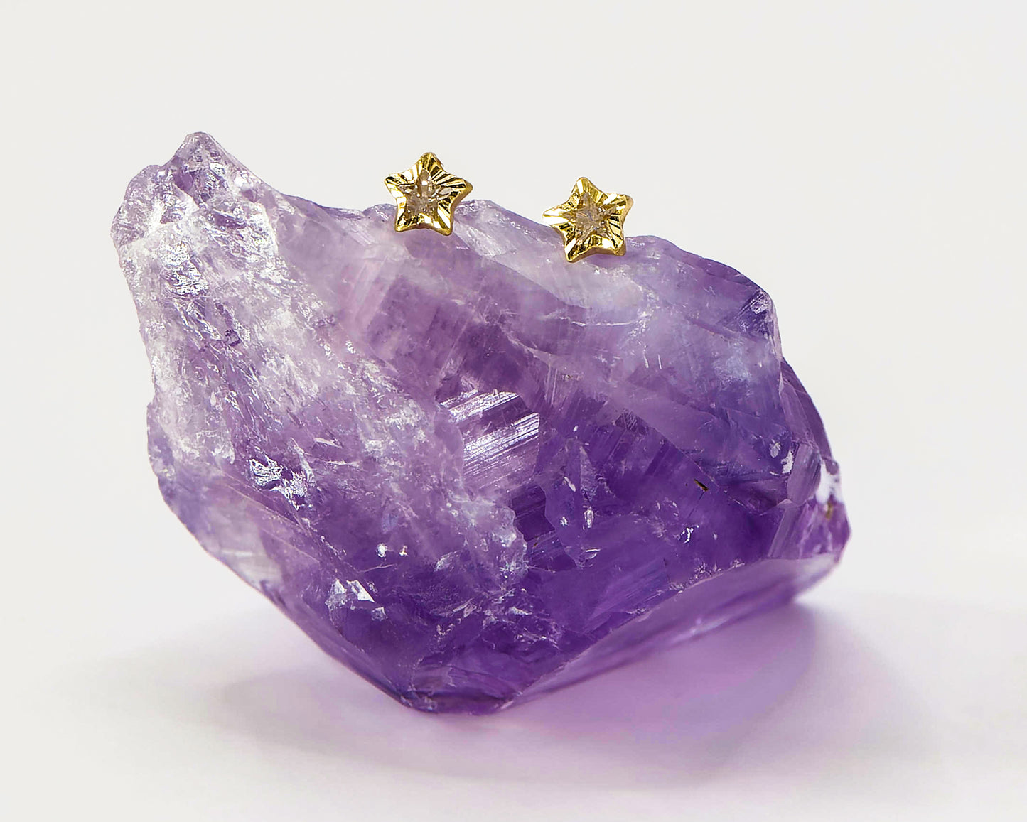 Arete tipo broquel 14k estrella de zirconia