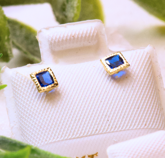 Aretes tipo broquel con zirconita azul 14k